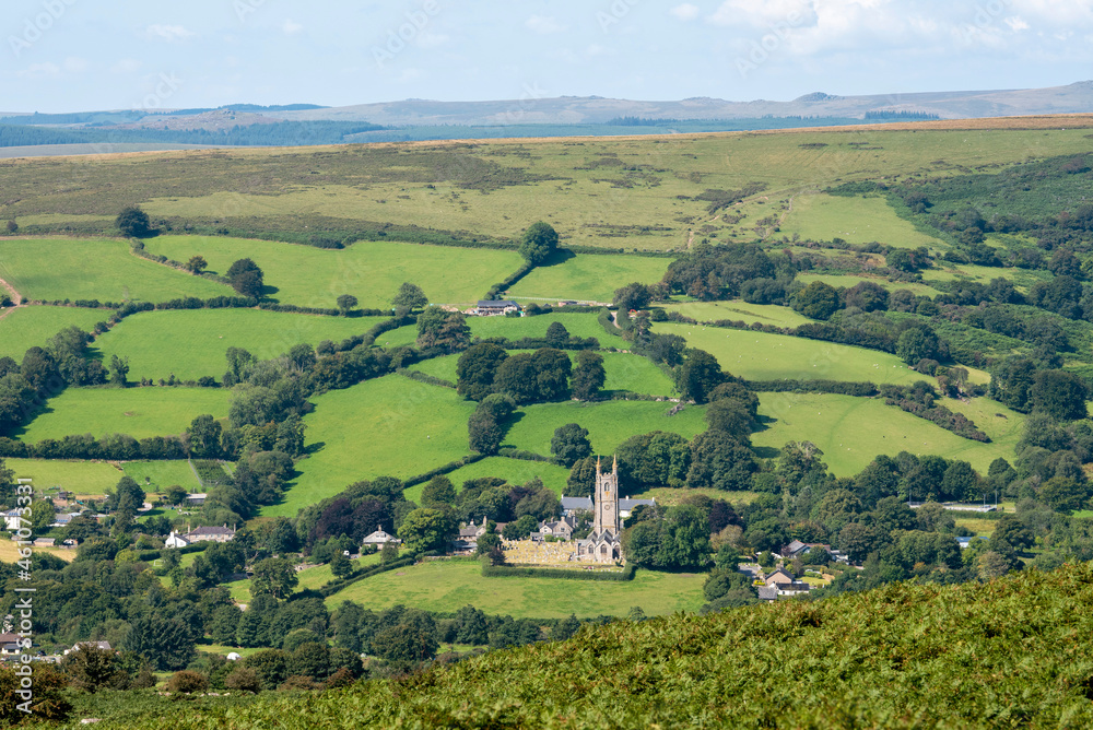 Widecombe in the Moor, Dartmoor, Devon, England, UK. 2021.  The church of St Pancras also known as Cathedral of the Moors with a backdrop of Dartmoor, Devon, UK.