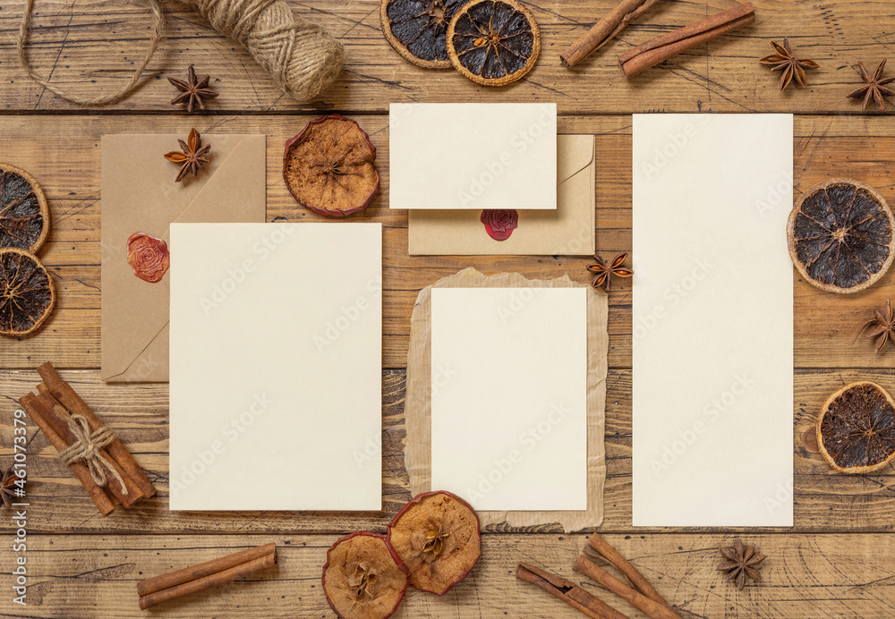 Chritsmas Composition with a blank cards, envelope, spices and dried fruits on wood Chritsmas Composition with a blank cards, envelope, spices and dried fruits on wood