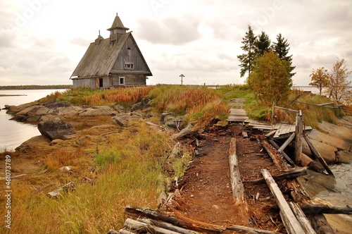 Russian atmosphere in countryside, lonely wooden house on the edge of village on shores of White sea, Northern Karelia