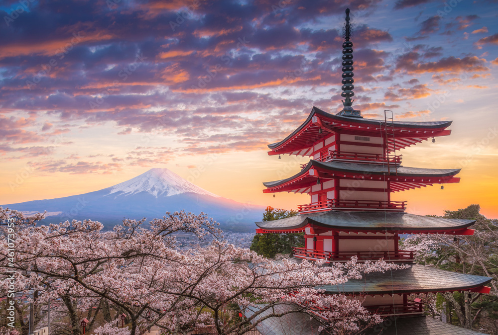 .Mount Fujisan beautiful landscapes on sunset. Fujiyoshida, Japan at Chureito Pagoda and Mt. Fuji in the spring with cherry blossoms.