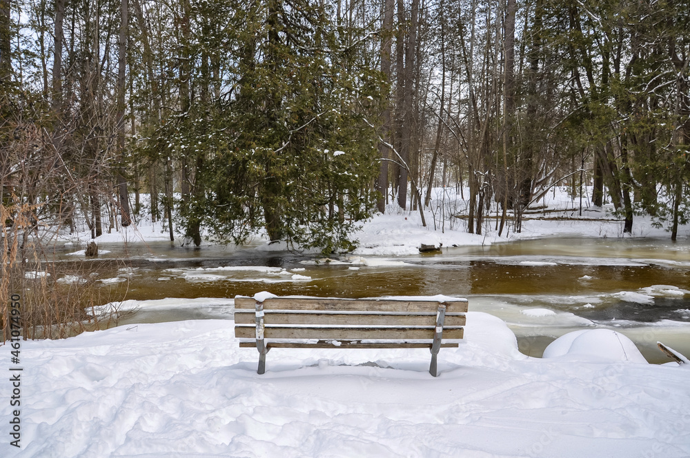 Bench in the snow in winter