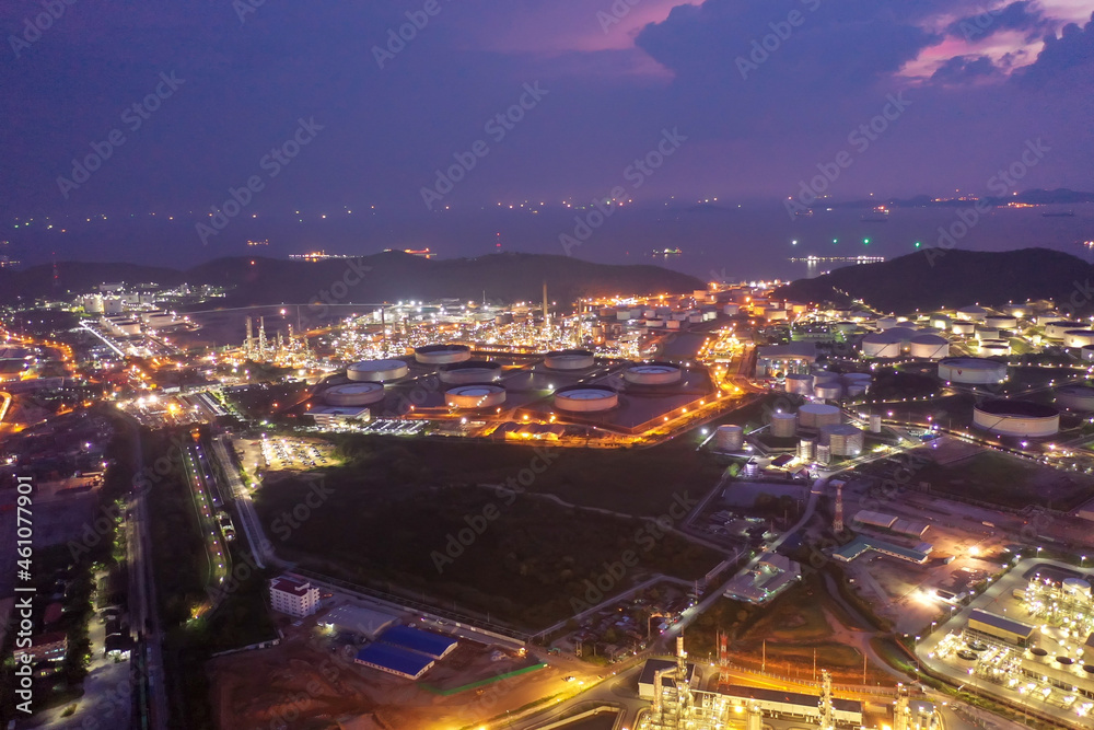 Aerial view of twilight petrochemical oil refinery plants,sea ...