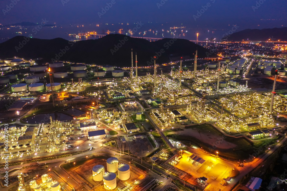 Aerial view of twilight petrochemical oil refinery plants,sea ...