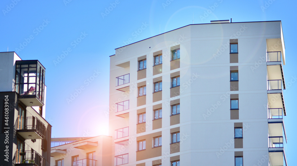Modern apartment building. Modern urban architecture and details of building facade. Sunlight.