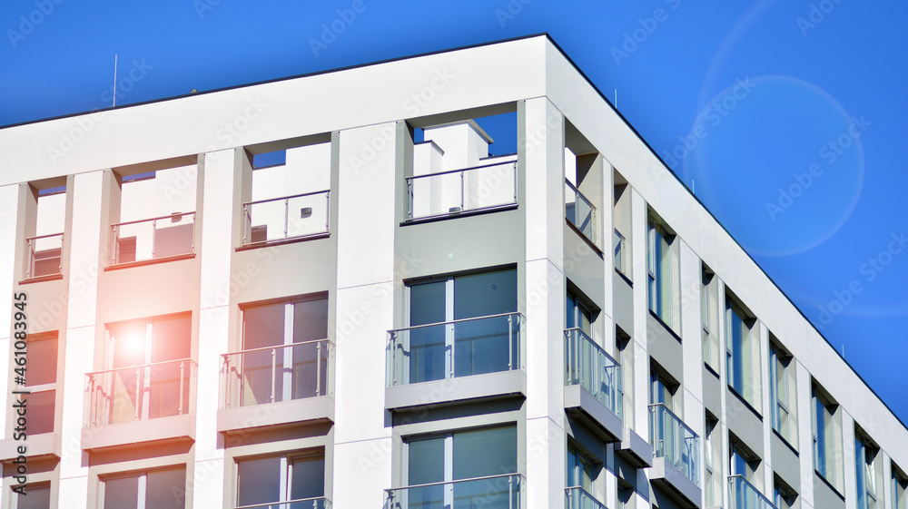 Modern apartment building. Modern urban architecture and details of building facade. Sunlight. Modern apartment building. Modern urban architecture and details of building facade. Sunlight.