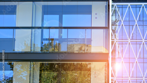 Modern apartment building. Modern urban architecture and details of building facade. Sunlight.