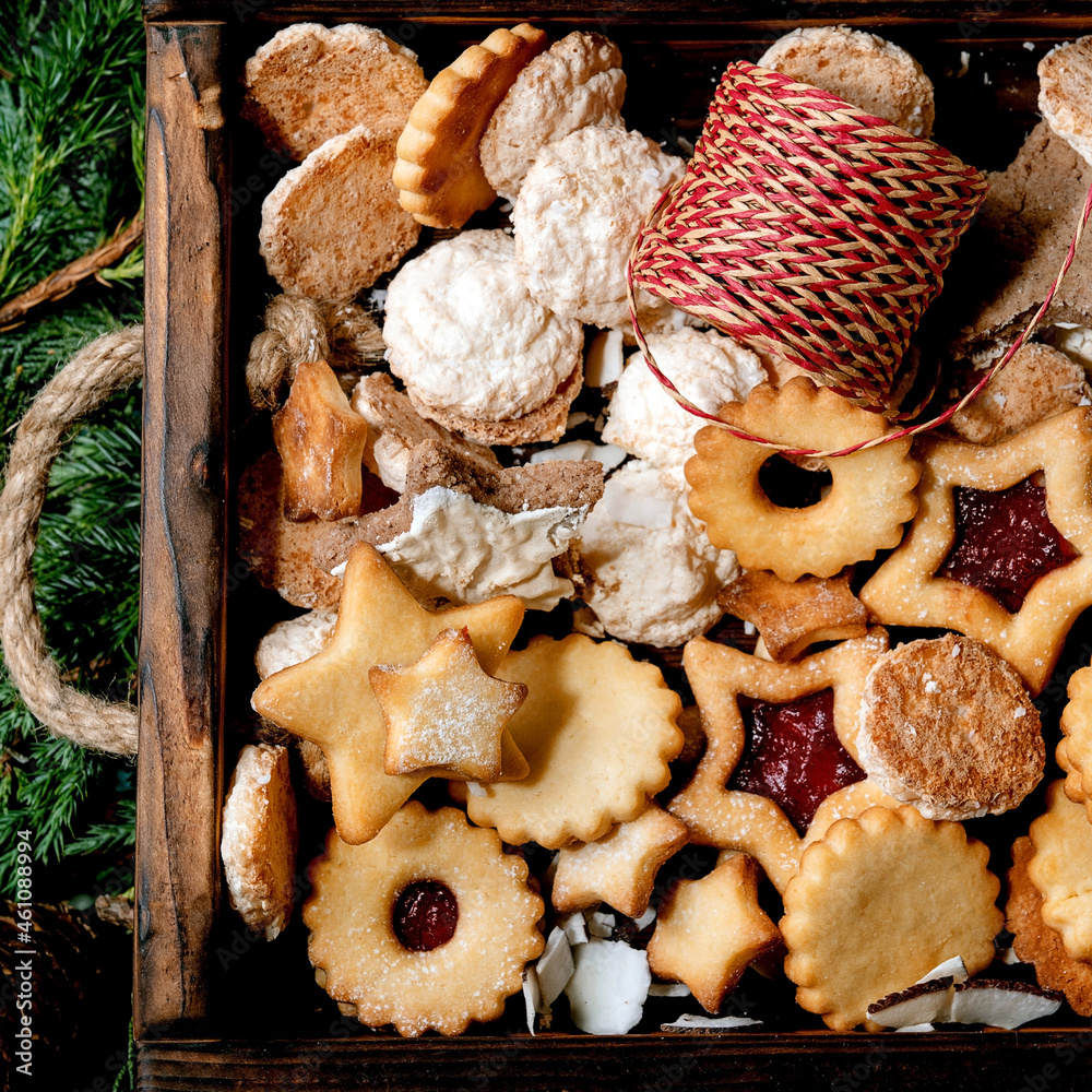 Christmas Homemade shortbread biscuits cookies collection on thuja branches. Top view Christmas Homemade shortbread biscuits cookies collection on thuja branches. Top view