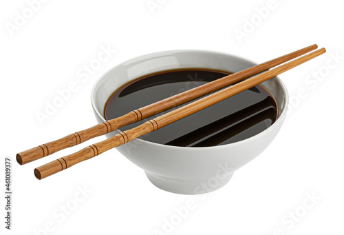 Soy sauce and chopsticks isolated on white background 