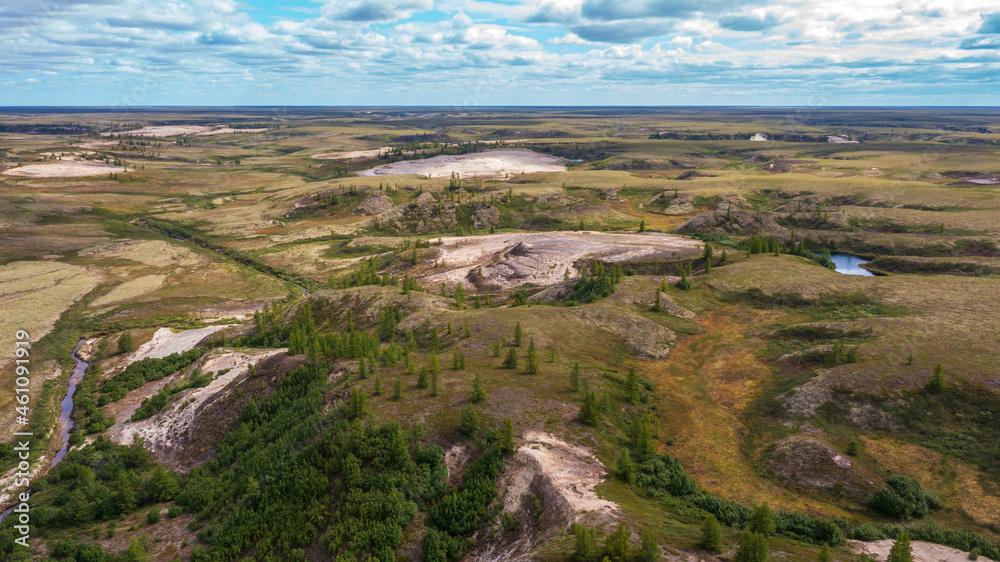 Landscape of the forest-tundra and the sandy river bank, photo from quadrocopter, bird's eye view, beautiful ravines of unusual shape.Arctic Circle, tunda