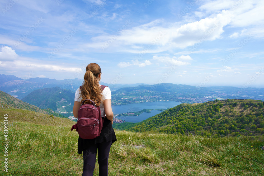 Female hiker enjoying landscape after trekking on mountains from belvedere