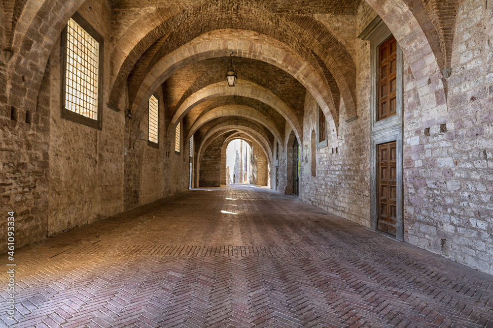 Games of light that filters through the windows inside the Palazzo Ducale in Gubbio