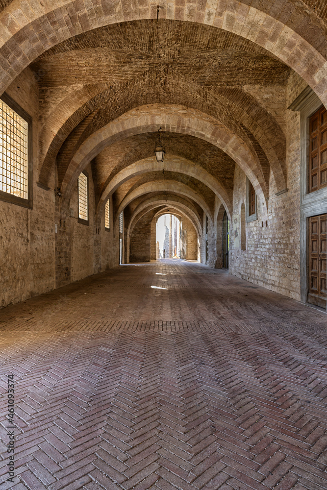 Games of light that filters through the windows inside the Palazzo Ducale in Gubbio