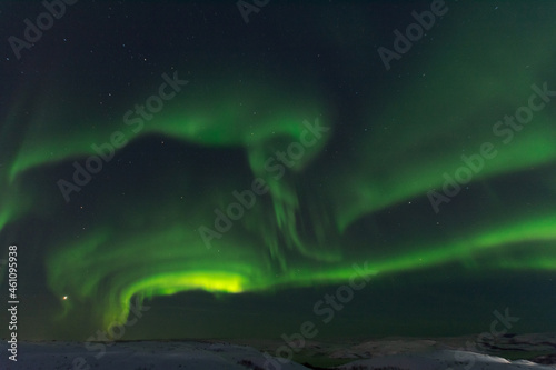 At night in winter, the tundra and the aurora borealis. © Moroshka