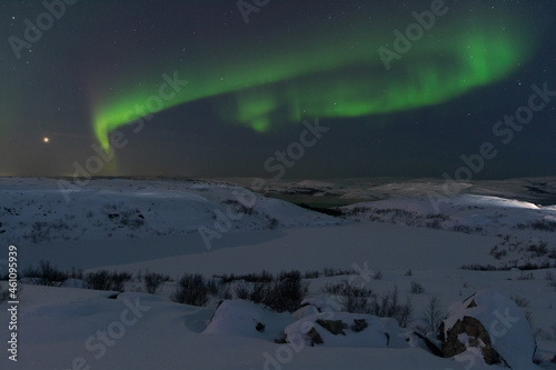 At night in winter  the tundra and the aurora borealis.