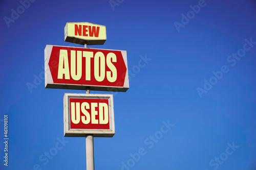 Aged and worn new and used autos sign