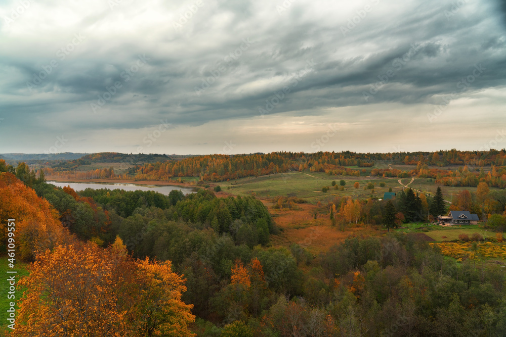 landscape autumn forest and cloudy sky