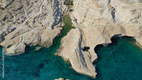 Aerial drone photo of iconic lunar volcanic white chalk beach and caves of Sarakiniko, Milos island, Cyclades, Greece