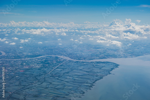 Wallpaper Mural Aerial view scene of the sea or ocean which hiding under white fluffy clouds and blue bright sky background. Torontodigital.ca
