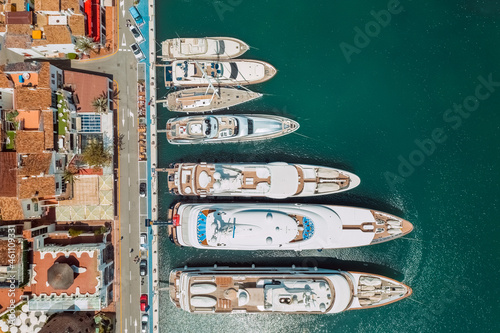 Aerial top view of luxury yachts in Puerto Banus marina, Marbella, Spain photo
