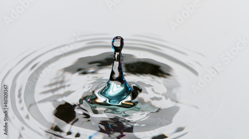 Canvas Print Freeze motion shot of water drops falling on water surface