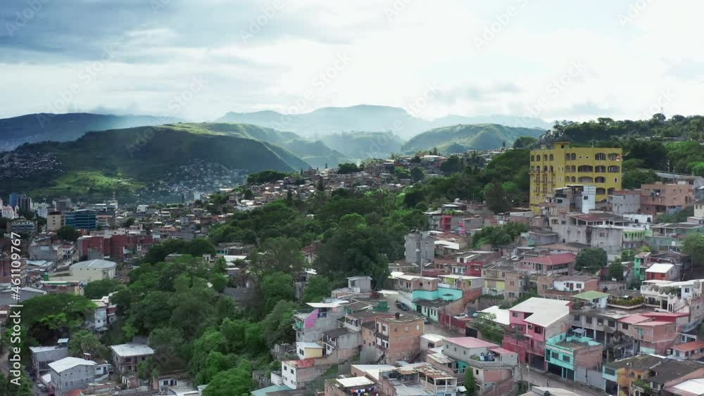Aerial view of the poor area of Tegucigalpa. A criminal slum district in the capital of Central America. A landscape of mountains on which huts are built in Honduras. Aerial view of the poor area of Tegucigalpa. A criminal slum district in the capital of Central America. A landscape of mountains on which huts are built in Honduras.