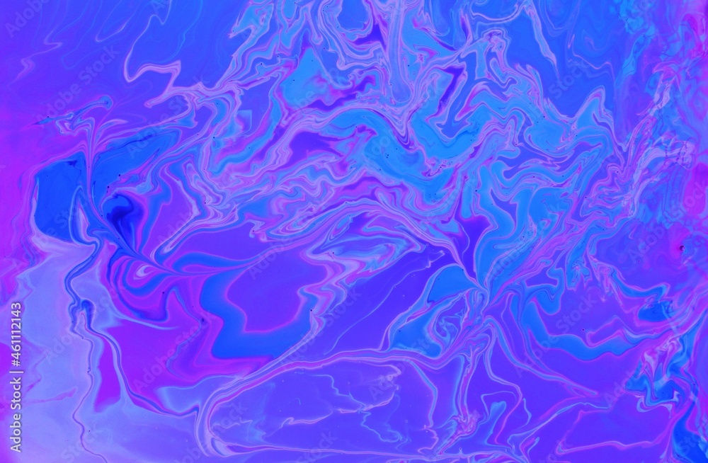 Abstract purple-blue marble background. Acrylic paint mixes freely and creates an interesting pattern. Bright saturated shades. Background for the cover of a laptop, laptop.