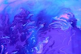 Abstract purple-blue marble background. Acrylic paint mixes freely and creates an interesting pattern. Bright saturated shades. Background for the cover of a laptop, laptop.