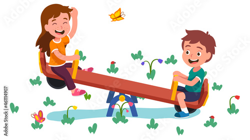Happy girl, boy kids swinging on seesaw together photo