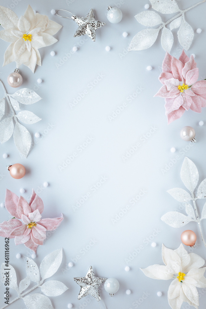 Christmas and New Year holidays frame. Christmas ornaments on light pastel background. Flat lay, copy space. Christmas and New Year holidays frame. Christmas ornaments on light pastel background. Flat lay, copy space.