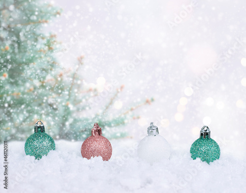 christmas bells in the snow on the white background with green pine