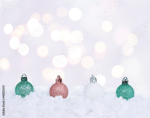 christmas bells in the snow on the white background with christmas lights	