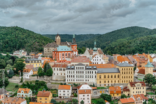 Panoramic view of famous medieval town of Loket,Elbogen, with colorful houses and stone castle above river,Czech Republic.Historical city centre is national monument.Travel architecture background photo