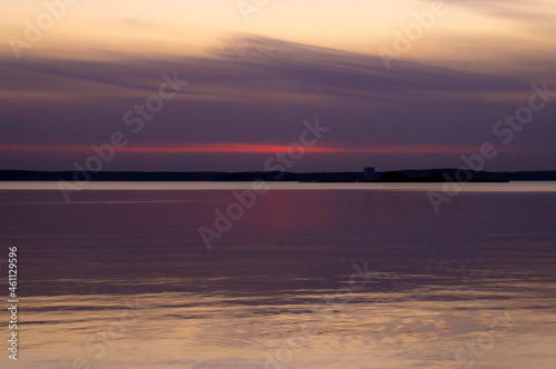 Beautiful sunset on the lake on an autumn evening.