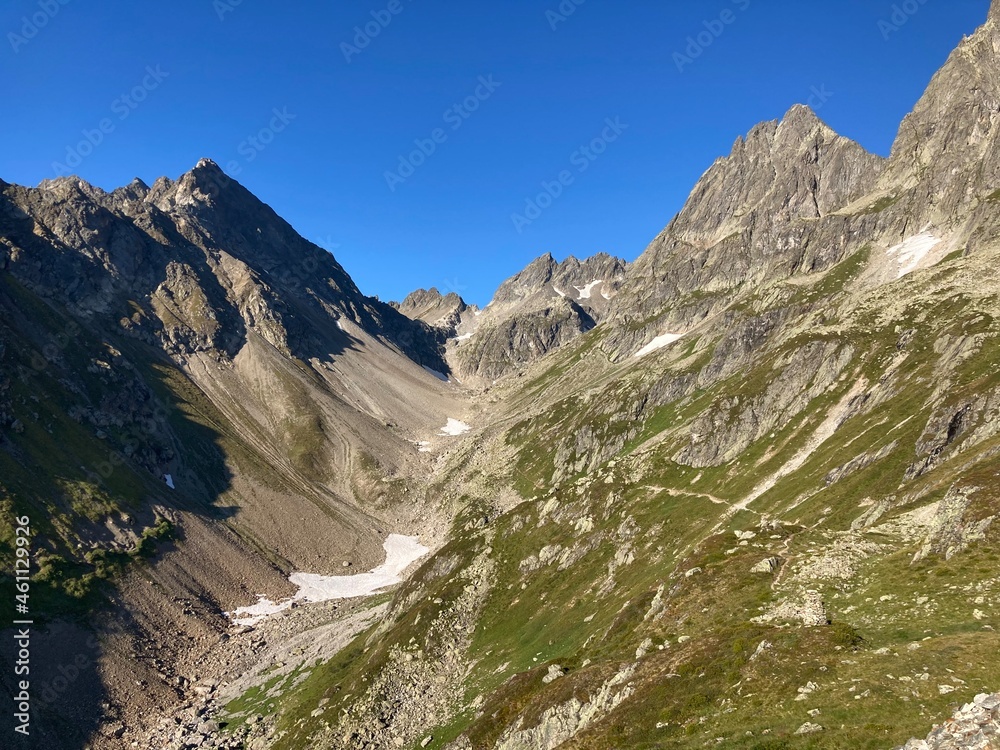summer scenery of mountain peaks with snow