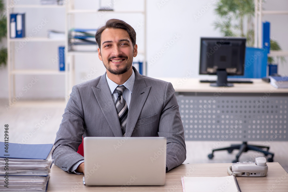 Young businessman employee working in the office Young businessman employee working in the office