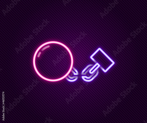Glowing neon line Ball on chain icon isolated on black background. Colorful outline concept. Vector