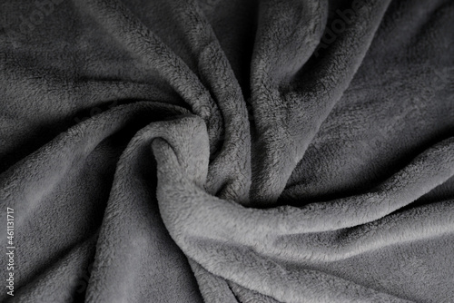 Soft fabric background. Grey blanket texture. Wave material pattern. Decorative curtain textile background. Wool texture. Cotton fabric pattern.