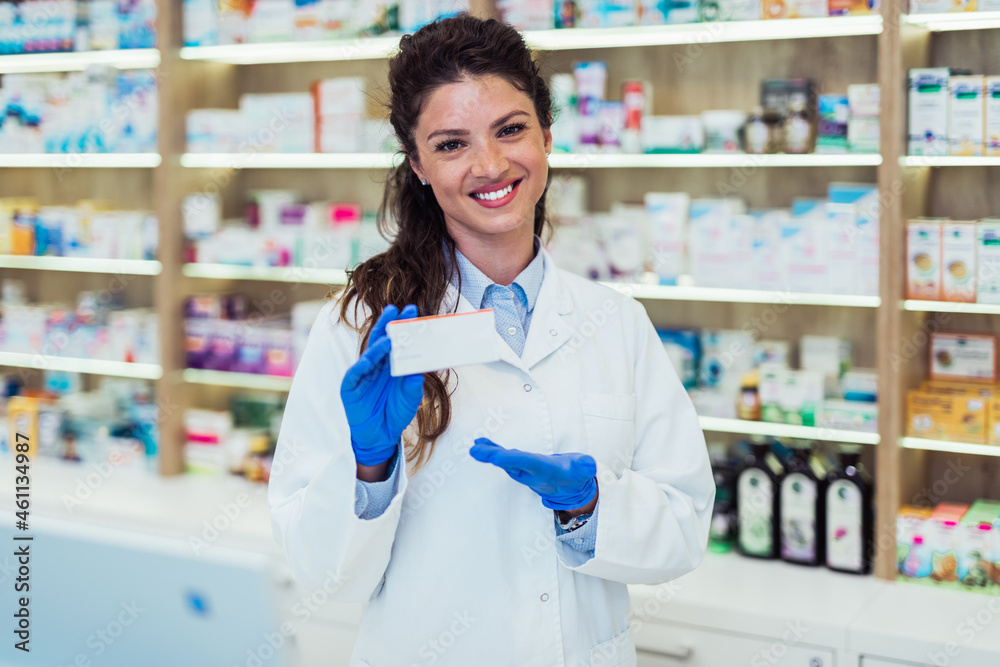 Female pharmacist working at pharmacy. Medical healthcare concept.