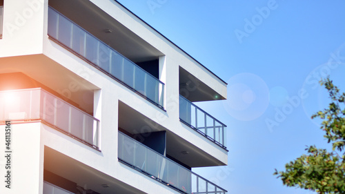 Modern apartment building. Modern urban architecture and details of building facade. Sunlight.