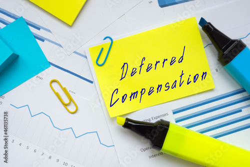 Business concept meaning Deferred Compensation with sign on the piece of paper.