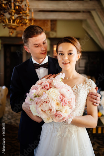 portrait of happy newlyweds in the interior. event planner services. 