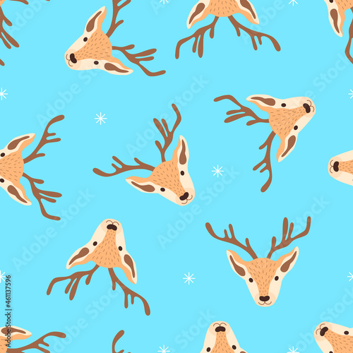 Christmas pattern with heads of reindeers on a blue background. Vector illustration 