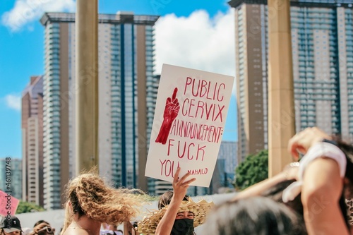 Public cervix announcement sign at women's march