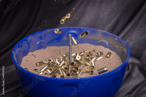 Reloading 9mm brass casing: cleaning and polishing  with tumbler using walnut shell media.