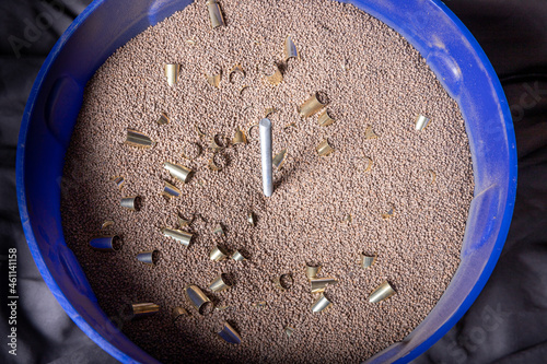 Reloading 9mm brass casing: cleaning and polishing  with tumbler using walnut shell media.