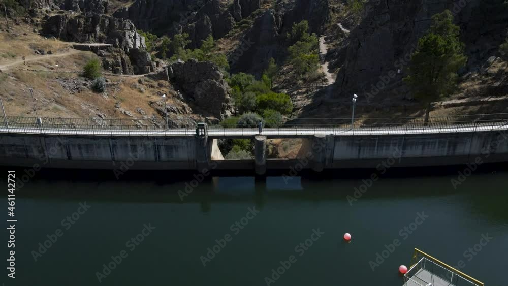 Woman over Penha Garcia reservoir, Portugal. Aerial backward acsendent Woman over Penha Garcia reservoir, Portugal. Aerial backward acsendent