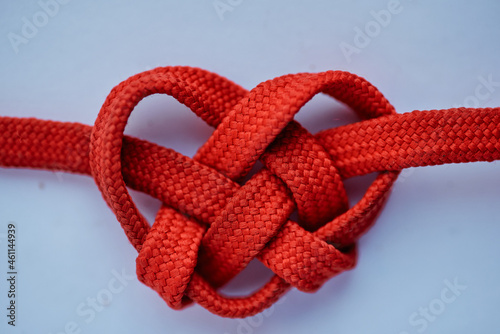 Shoelace knit into a heart shape in the depiction of love and marking of valentine. 
