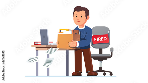 Just fired man. Employee holding belongings box