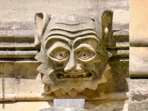 Fotografia, Obraz Face gargoyle of gothic Cathedral in Winchester, England, UK