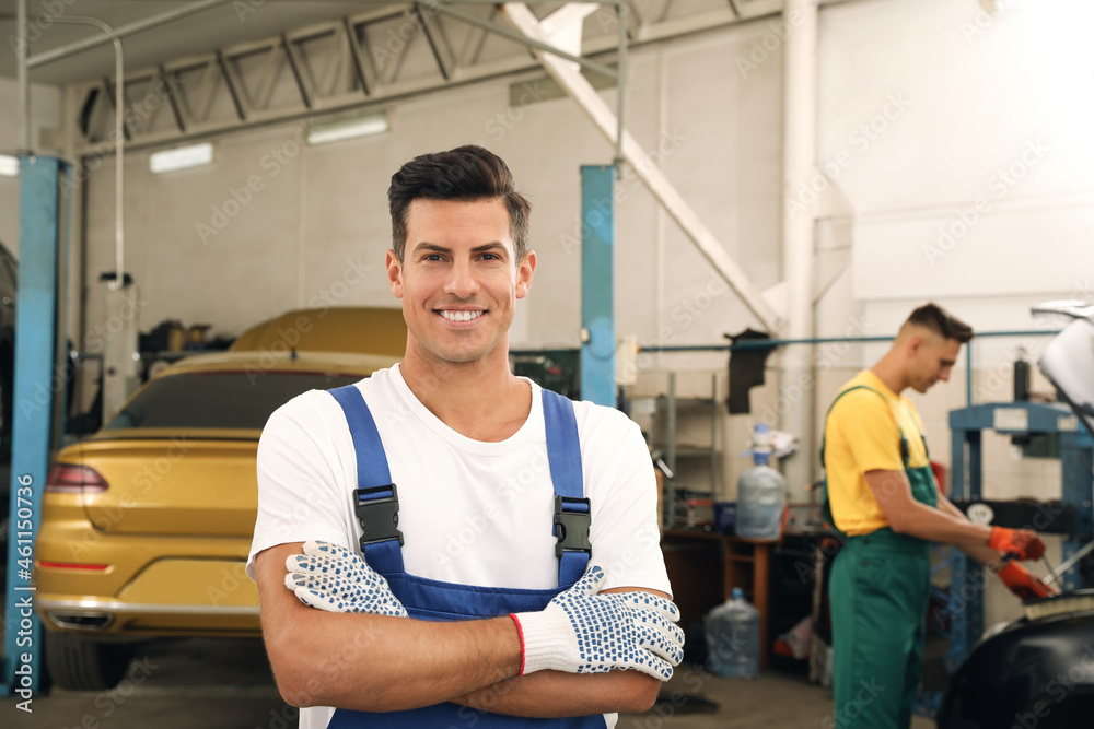 Portrait of professional mechanic at automobile repair shop Portrait of professional mechanic at automobile repair shop